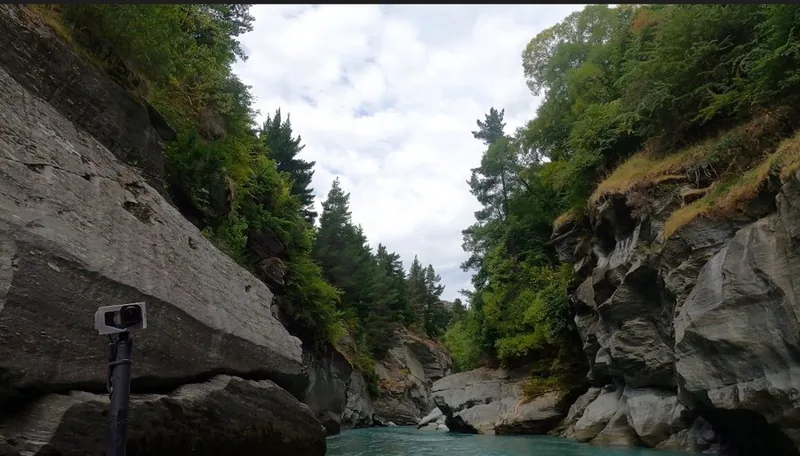 Sheer rock walls rising above the Shotover canyon